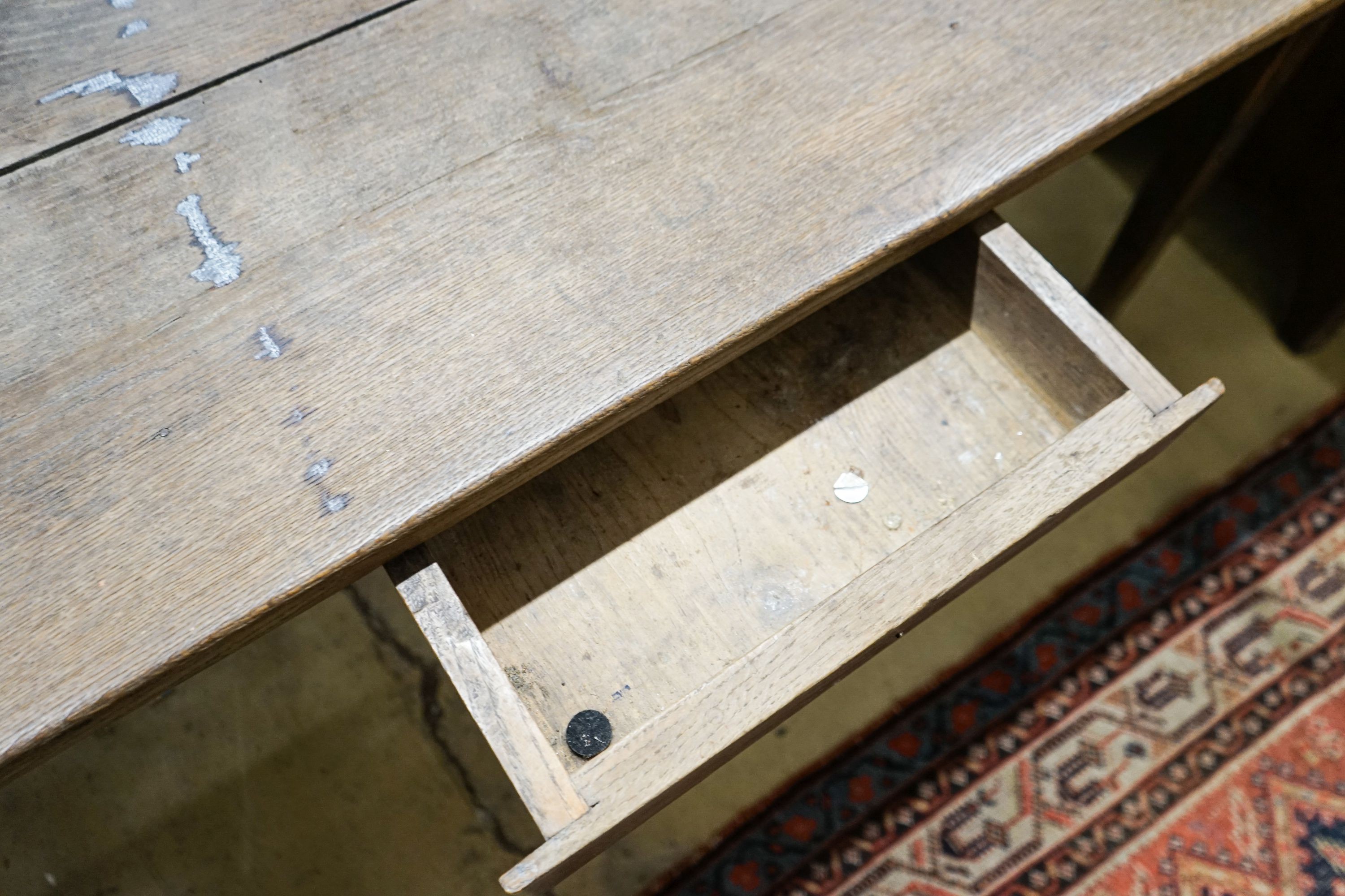 An early 19th century French provincial oak farmhouse table, fitted drawer, length 175cm, depth 86cm, height 73cm